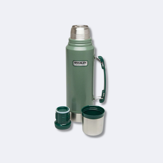 Disassembled STANLEY Classic Vacuum Bottle with Lid, Cup, and Stopper – Green Stainless Steel Thermos for Hot and Cold Drinks